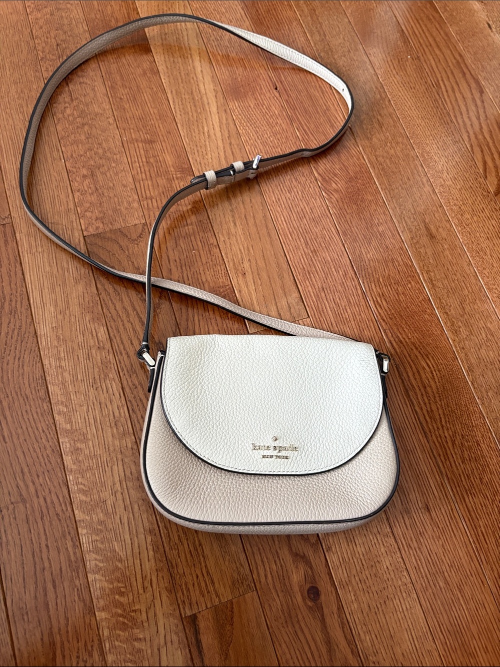 Kate Spade Leila Mini Flap Crossbody in a two-tone warm beige and parchment